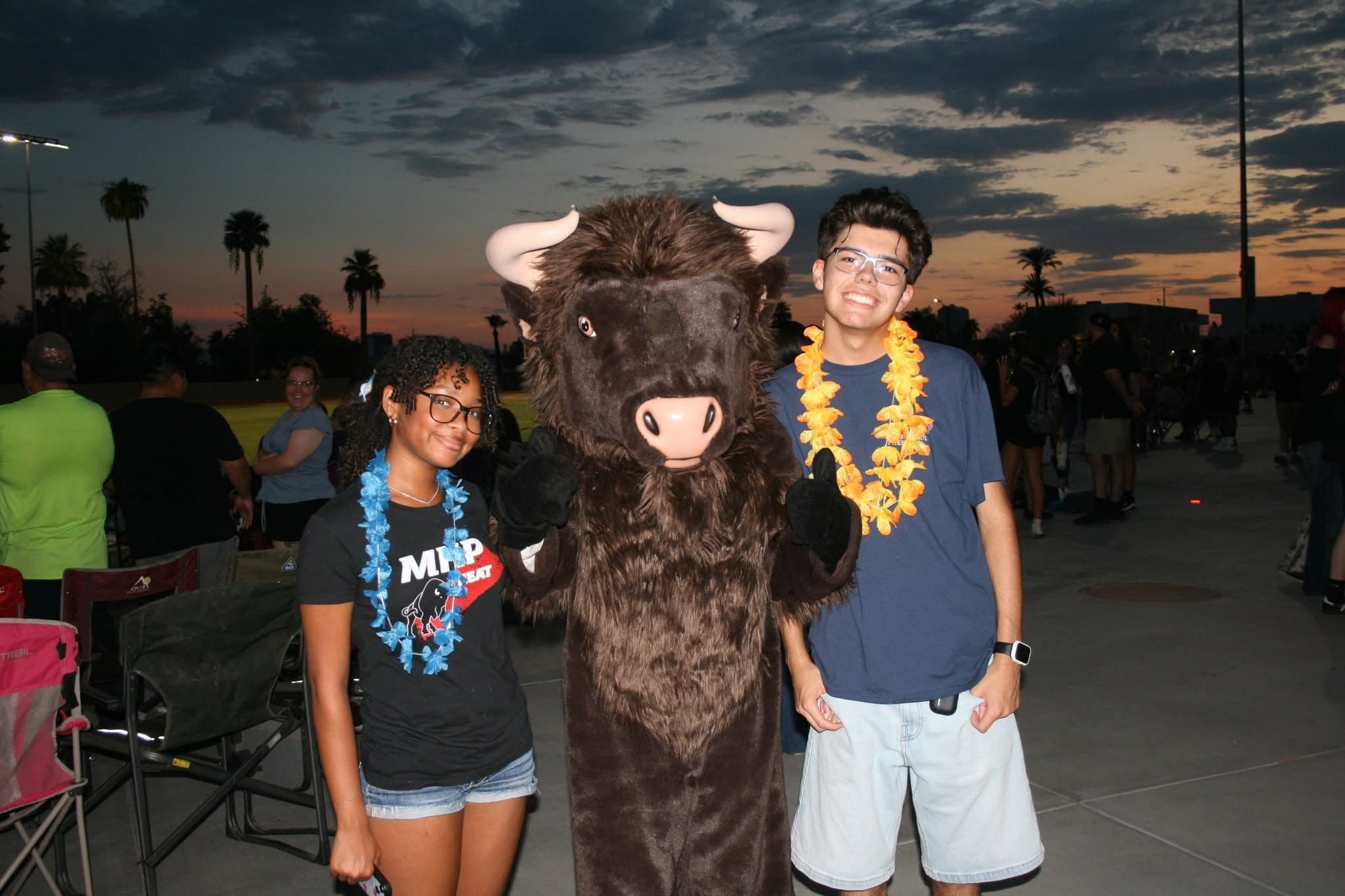 Madison Highland Prep students with the Heat bison mascot at a sunset campus event
